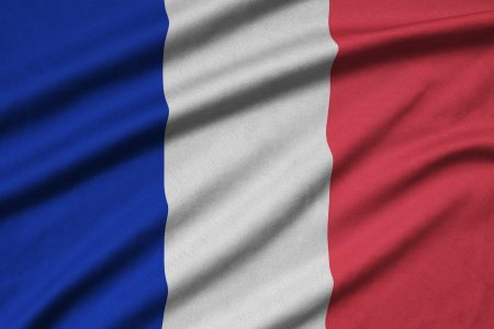 France flag is depicted on a sports cloth fabric with many folds. Sport team waving banner